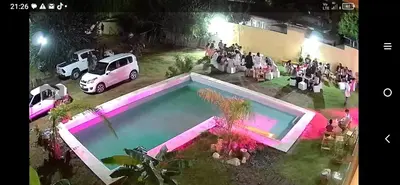 an overhead view of a wedding with a car and a pool at Dúplex, Alejandría in Villa Carlos Paz