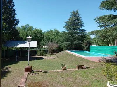 a yard with a swimming pool and a lamp at Villa Clara in Villa Parque Siquiman
