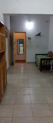a hallway with a room with a bed and a door at Villa Clara in Villa Parque Siquiman