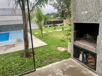 a view of a swimming pool from inside a building at Magdalena in Santa Rosa de Calamuchita