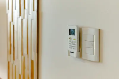 a remote control on a wall next to a radiator at TempoHome in Cordoba