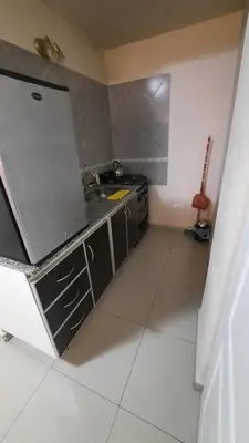 a kitchen with a sink and a counter at Alquiler de departamento céntrico en Villa Carlos Paz in Villa Carlos Paz