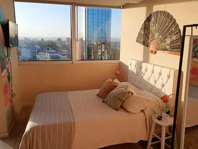 a bedroom with a bed and a large window at Candy House - Céntrico - Fabuloso - Seguridad 24 hs - Vista Insuperable in Cordoba