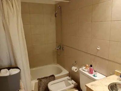 a bathroom with a tub and a toilet and a sink at Candy House - Céntrico - Fabuloso - Seguridad 24 hs - Vista Insuperable in Cordoba
