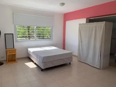 a bedroom with a bed and a window at Apartamentos Dorothy in Villa Santa Cruz del Lago