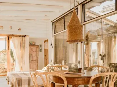 a dining room with a wooden table and chairs at Aldea Romerillo in Cavalango