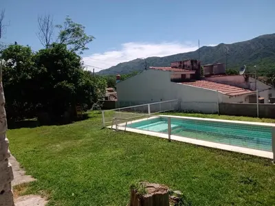 a swimming pool in the yard of a house at Mirando sierra in Bialet Massé