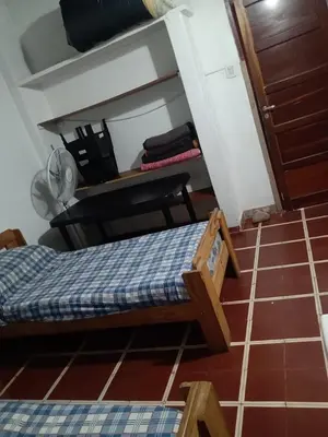 a small room with a bed and a chair at Mirando sierra in Bialet Massé