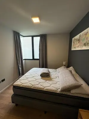 a bedroom with a bed and a window at Alquiler Ituzaingo 665 in Cordoba