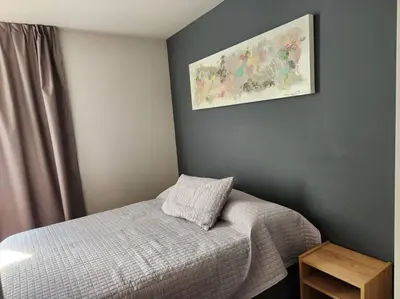 a bedroom with a bed and a picture on the wall at Alquiler Ituzaingo 665 in Cordoba