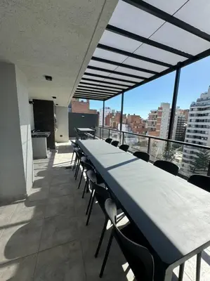 a row of tables and chairs on a balcony at Alquiler Ituzaingo 665 in Cordoba