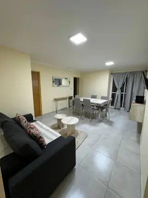 a living room with a couch and a table at Departamento 2 dormitorios in Cordoba