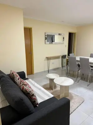 a living room with a couch and a table at Departamento 2 dormitorios in Cordoba