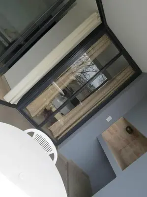 an overhead view of a room with a table and a window at TEMPO Departamento 43 in Villa Carlos Paz