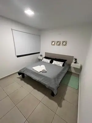 a bedroom with a bed and a whiteboard on the wall at Terra Bella in San Antonio de Arredondo