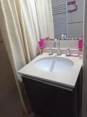 a bathroom with a sink and a mirror at Terraza Terraza in Villa Carlos Paz