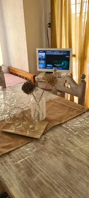 a wooden table with a computer on top of it at Cabaña en Punilla in Villa Parque Siquiman