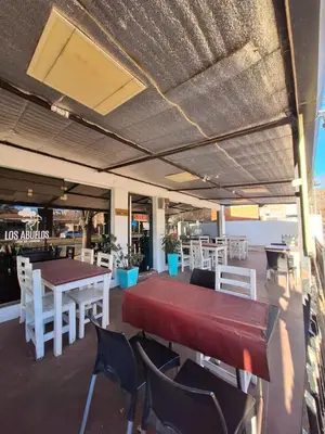 a dining room with a table and chairs at El Redentor in Villa Carlos Paz