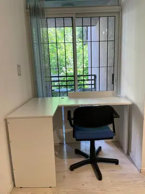 a desk with a chair next to a window at Departamento Nueva Cordoba in Cordoba