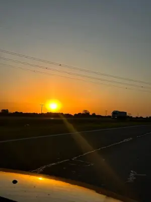 a sunset on the side of a highway at LaJu in Villa Yacanto