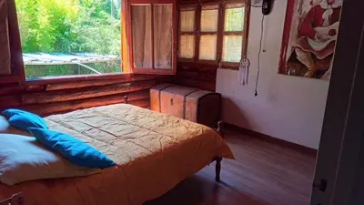 a bedroom with a bed and a window at Chalet Tala Huasi, Costa Rio, Pileta in Villa Icho Cruz