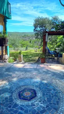 a patio with a mosaic tile floor with a view at Chalet Tala Huasi, Costa Rio, Pileta in Villa Icho Cruz