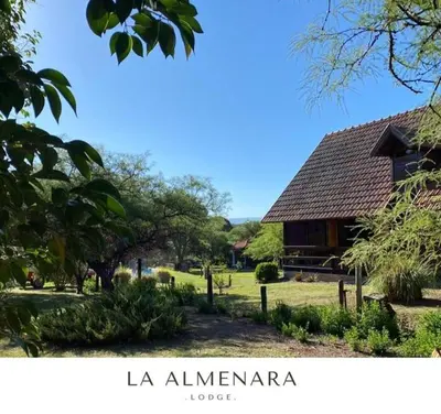 a picture of a house in a park at La Almenara Lodge in Villa General Belgrano