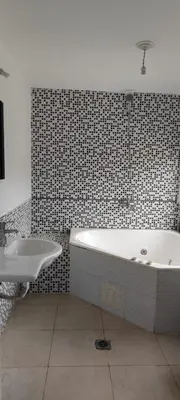 a bathroom with a bath tub and a sink at Casa villa el diquecito in La Calera