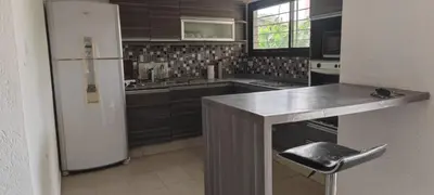 a kitchen with a white refrigerator and a counter at Casa villa el diquecito in La Calera