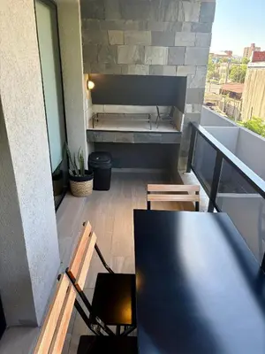 a view of a balcony with a table and chairs at Complejo Las Pircas Alta Gracia in Alta Gracia