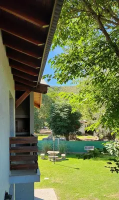 a porch of a house with a view of a yard at departamento al pie de las sierras in Villa General Belgrano