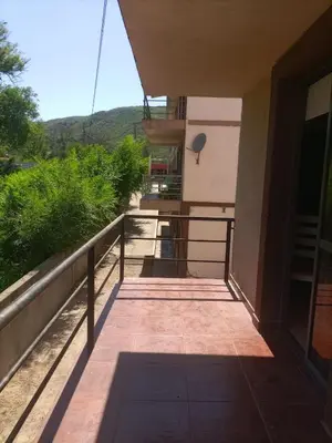 a balcony of a building with a view of a mountain at Departamento en Villa Carlos Paz in Villa Carlos Paz