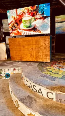 a wooden box with a picture of a cup of coffee at HOSTEL CASA C Alojamiento, Coworking y Centro Cultural in Villa General Belgrano