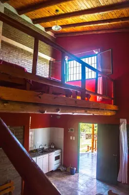 a kitchen with a bunk bed in a house at Complejo Fra Noi in Villa Anizacate