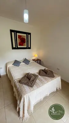 a bedroom with a bed in a room at La Emilia in Las Rabonas