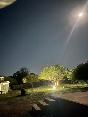 a group of benches in a park at night at La Emilia in Las Rabonas
