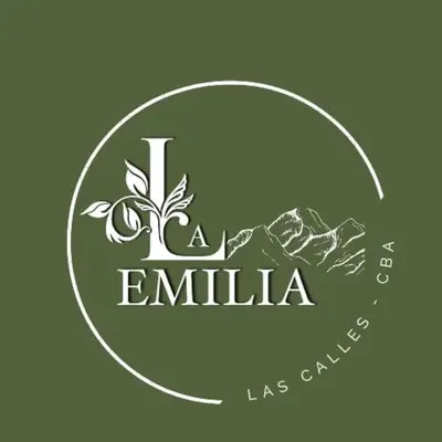 a logo for a emilia restaurant with mountains in the background at La Emilia in Las Rabonas