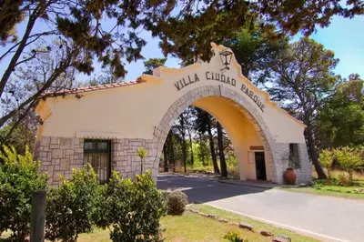 an entrance to a building with an arch at Cabaña los cuates in Villa Ciudad Parque