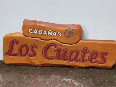 a sign for a los angelesos calheaders on a wall at Cabaña los cuates in Villa Ciudad Parque