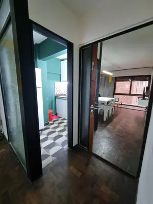 an open door to a room with a dining room at Chacabuco Confort - Bienes Reales in Cordoba