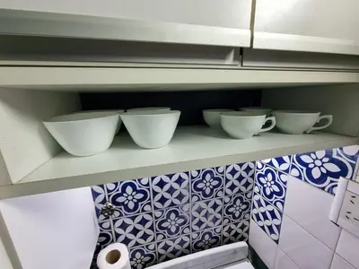 three bowls on a shelf in a kitchen at Chacabuco Confort - Bienes Reales in Cordoba
