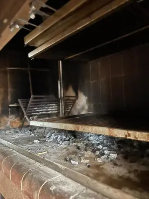 a dirty oven with a bunch of rubble at Mansion de Potrero in La Estancia