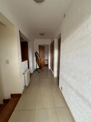 an empty hallway of a house with a chair at Mansion de Potrero in La Estancia