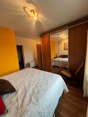 a bedroom with a large bed and a mirror at Mansion de Potrero in La Estancia
