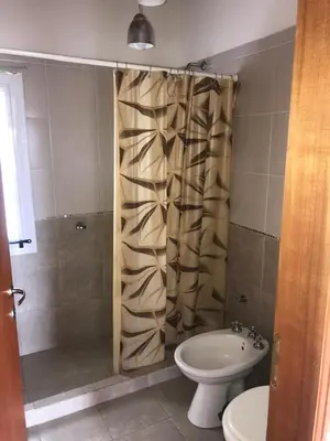 a bathroom with a shower with a toilet and a sink at Cabañas Luciano in Arroyo de Los Patos