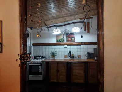a kitchen with a stove and a counter top at La Rustica in El Durazno
