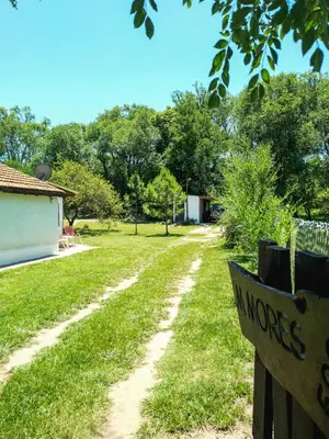 a dirt road leading to a yard with a fence at Casa VD in Santa Rosa de Calamuchita