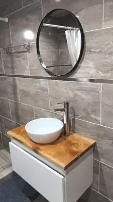 a bathroom with a white sink and a mirror at Las Carolas in Santa María