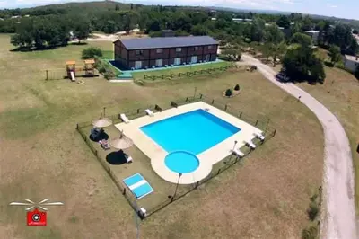 an aerial view of a house with a swimming pool at Estancia la aguada in Embalse