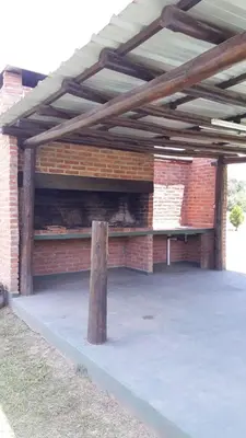 a brick building with awning on top of it at Estancia la aguada in Embalse
